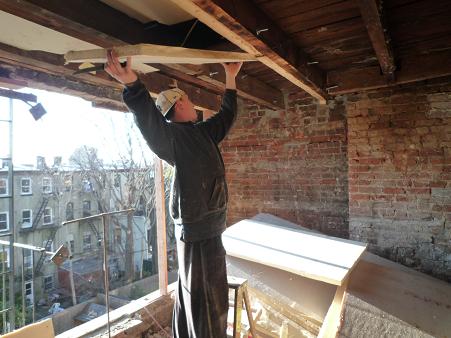 inserting polyiso insulation into the ceiling