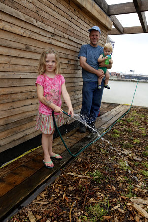 green builder with family on green roof in brooklyn