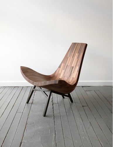 a sleek wooden chair made from salvaged materials